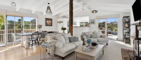 Classic coastal home is filled with natural light, sea breezes and fabulous indoor-outdoor living spaces