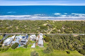 Step into a serene coastal retreat at ‘Oceanside Haven’, situated opposite a stunning surf beach in Ocean Grove