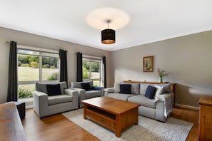 The formal living room - cozy with garden views 