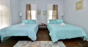 2 queen size beds in room with double beds