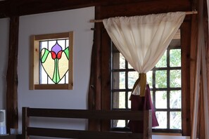 2nd floor guest room (antique stained glass and lattice windows)