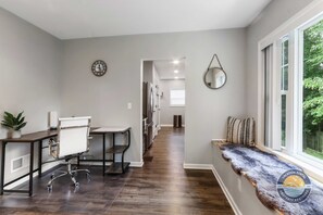 Dedicated work station area, featuring a chair and a convenient setup for getting things done
