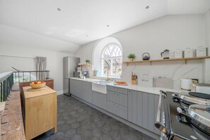 The Old Chapel, Stoke Abbott: The attractive kitchen with plenty of space for preparing something delicious