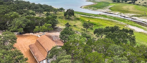 Aerial view showing property and Canyon Lake behind it.