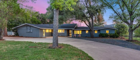 This spacious lakeside home offers driveway parking for 8 vehicles