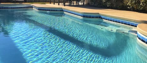 Private pool inn backyard with strip view
