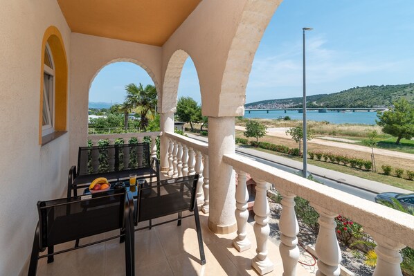 Balcony with sitting area & sea view