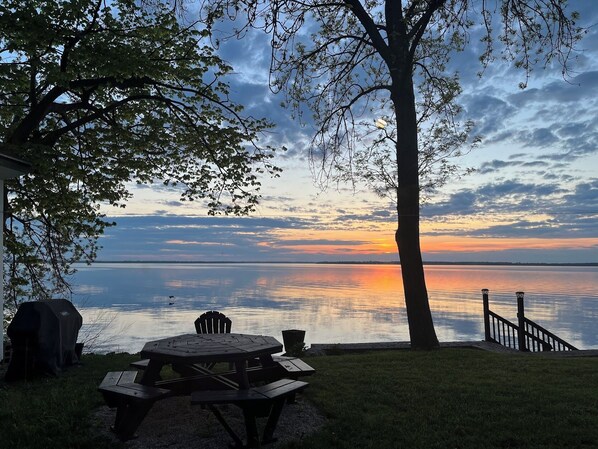 Incredible sunsets over Lake Champlain from inside and outside the cottage.