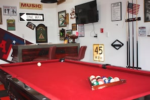 Pool table and bar area in garage.