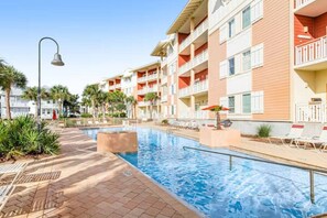 Gorgeous, zero-entry community pool and hot tub, which sits on the bank of the canal.