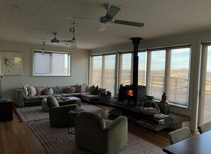 Expansive living area with TV, board games and views through large windows