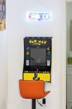 Arcade corner with Pac-Man arcade game with multiple games to play.