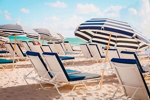 On the beach, beach cabanas, sun loungers