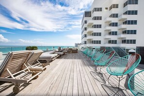 On the beach, beach cabanas, sun loungers