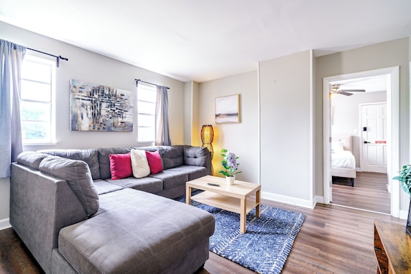 Modern and Inviting: Our living room offers modern furnishings in a clean, spacious setting. Enjoy the comfortable seating and welcoming environment. Perfect for relaxation and socializing Airbnb near Ohio State University Columbus!