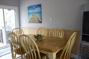 Kitchen table leading out to back deck.