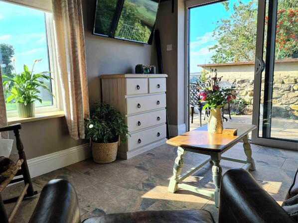 Rear living room with stunning views plus patio