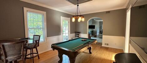 {GAME ROOM} pool table, high top seating and 65" smart TV