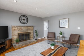 Main living room with view of side door entrance off Kitchen