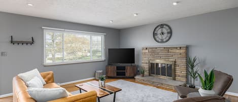 Main living room with large window that provides plenty of natural light