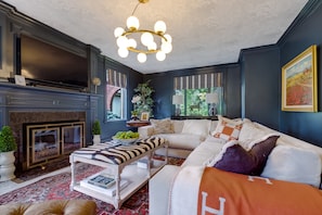 The west wing living room with working fireplace