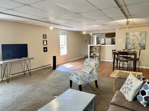 The living room features a Roku-TV for your enjoyment.