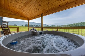 Hot tub on the deck with a view! Available all year round