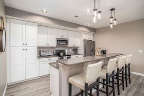 Sit at the countertop and enjoy conversation with those that are prepping the meal. Seating for 4. 