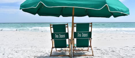 Relax on the beach with chairs & umbrella service provided, view from the condo!