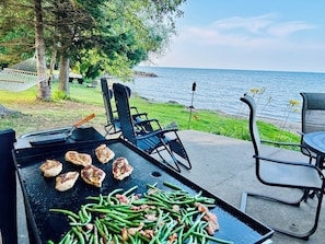 There is a 36” flattop for outdoor cooking and charcoal grill. 