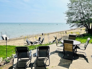 Watch the kids play on the beach from the patio