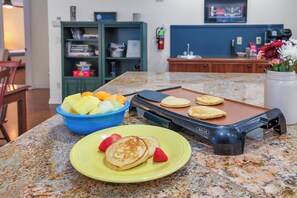 This kitchen is super well stocked and has everything you need to cook and bake at home, as well as tons of seating between the dining table (seats 6) and the bar (seats 8)