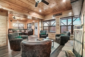 Cozy fireplace seating between the the living room and dining room