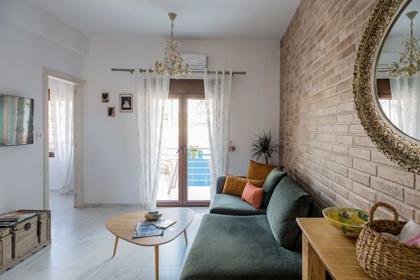 Inna suite has a nice and bright living room that connects to all rooms: the bathroom, the kitchen and the bedroom.