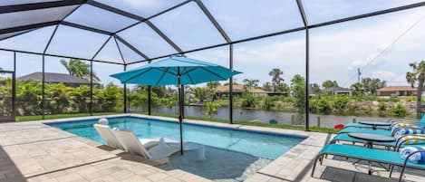 Crystal clear heated saltwater pool with breathtaking waterfront view