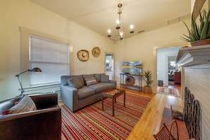 From front door, view of living room with pull-out sofa