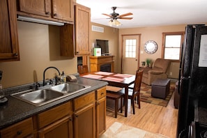 FULLY EQUIPPED KITCHEN / LIVING AND DINING AREA