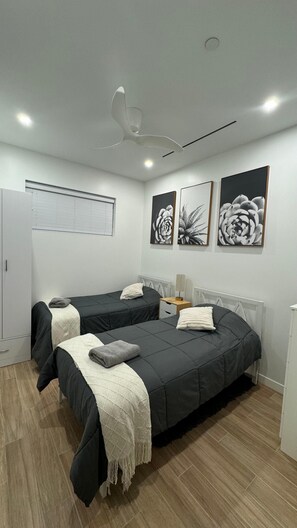 The 2nd bedroom, ideal for 2 adults or children. Ample hanging & storage space