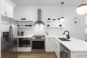 Fully stocked kitchen with all the utensils and cooking supplies you'll need for ease & convenience.