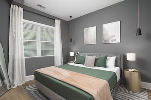 Comfortable king bed in bedroom #2 with custom lighting and a spacious closet for your belongings.