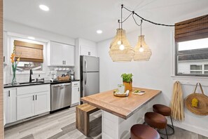 Eat-in kitchen with seating for seven guests