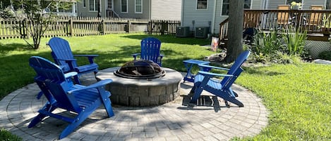 Back yard fire pit for evening enjoyment. Burning wood is provided. 
