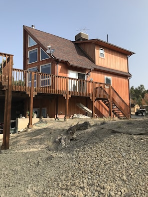The Chalet with large deck, showing A/C swamp cooler on roof