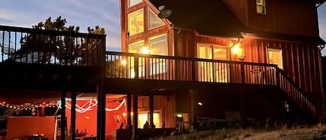 Chalet at dusk, a striking silhouette against the evening sky