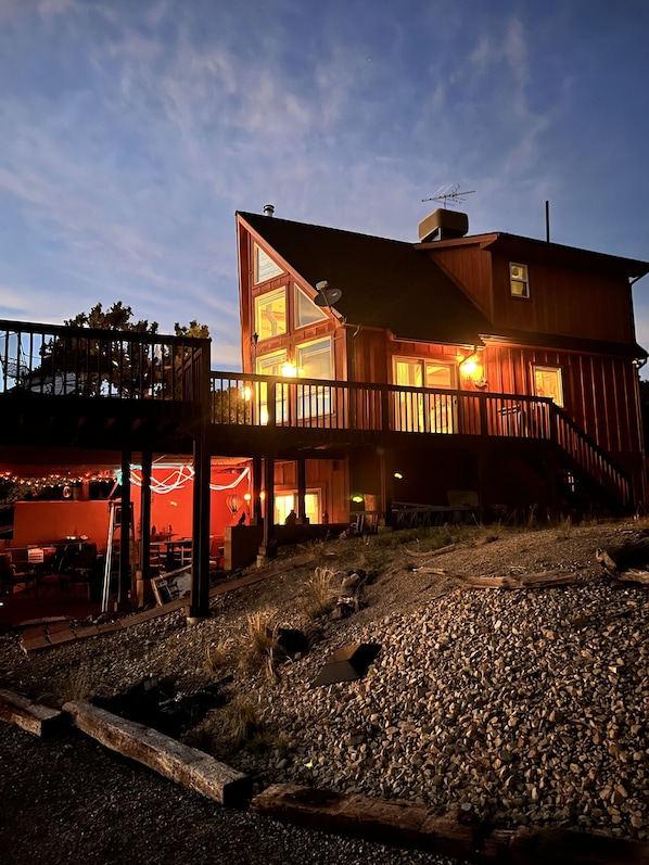 Chalet at dusk, a striking silhouette against the evening sky