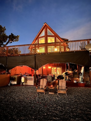 The Chalet, courtyard, deck and patio, with hardwood Adirondack chairs.