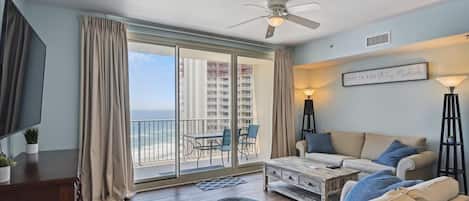 Living room with access to balcony and westward view of the Gulf!