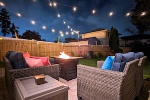 Embrace outdoor living no matter the season- or time of day- with a fire pit table, fresh sea air, and stunning skies.