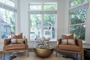 The living room features great natural light and great views outside