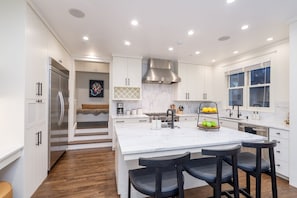 Custom designed High end Kitchen featuring high-quality appliances, elegant finishes and ample storage space.